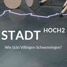 Dunkles Werbebild mit großem weißen Schriftzug STADT HOCH2 und kleinem Untertitel Wie tickt Villingen-Schwenningen? auf grafischem Hintergrund mit skizzenhafter Stadtlinie und Münzen